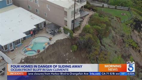 California homes teetering on edge of hillside after collapse: photos